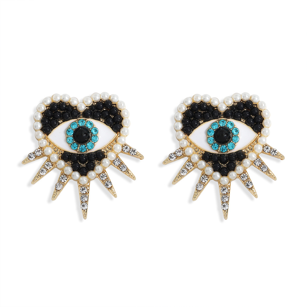 Fashion Demon Eye Heart Diamond Earrings display picture 5