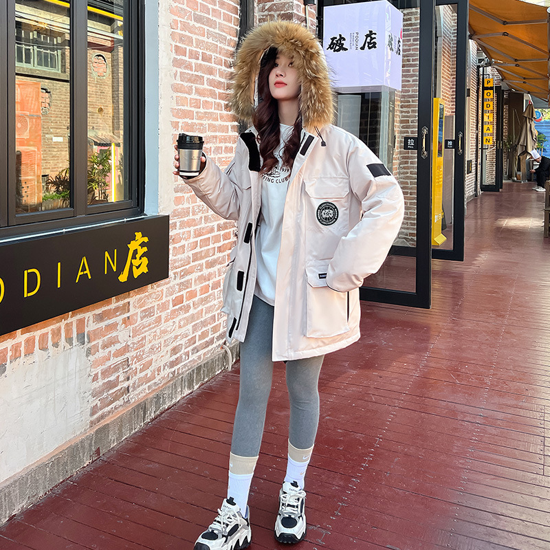 2025 invierno nuevo chaqueta de plumón de tamaño grande para mujeres medianas y largas piezas de herramientas gruesas para superar la armadura parejas de hombres y mujeres