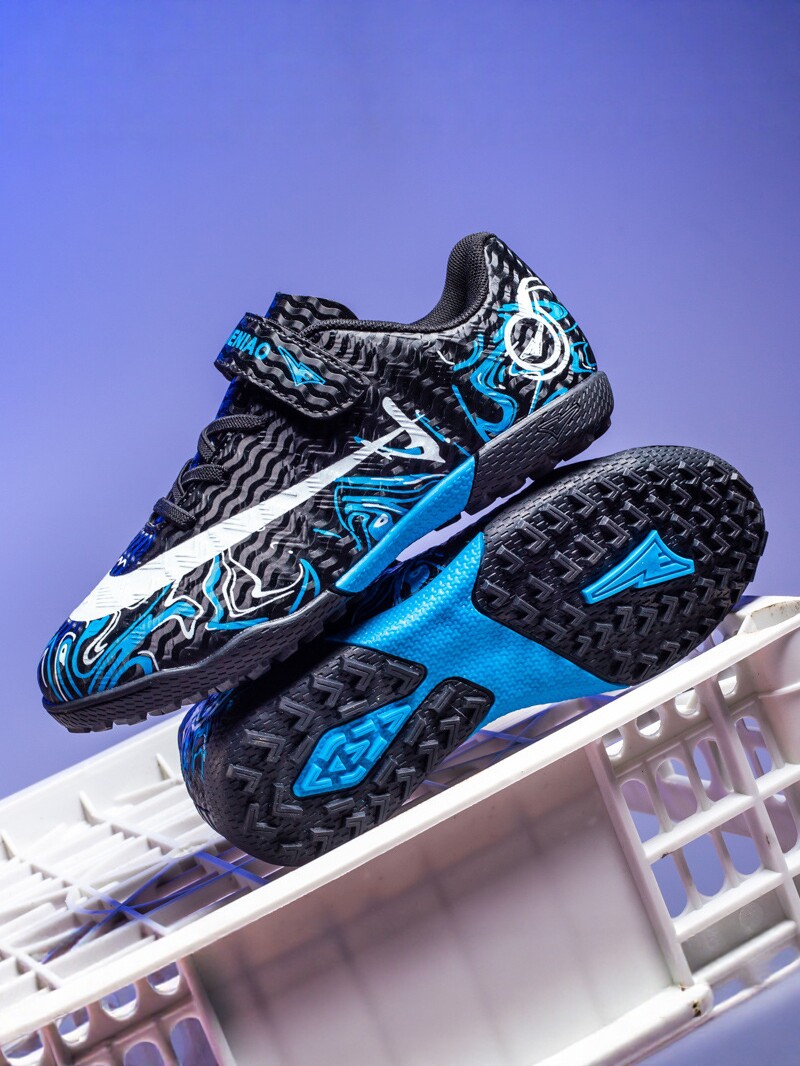 Zapatos de fútbol transfronterizos de alto perfil para hombres TF zapatos de entrenamiento antideslizante transpirables para niños zapatos deportivos profesionales para estudiantes