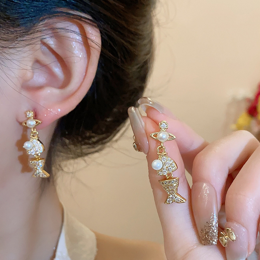 Pendientes de flor de lazo elegante de súper hada de plata Pendientes de moda de lujo ligero francés Pendientes de todo fósforo dulce de estilo literario