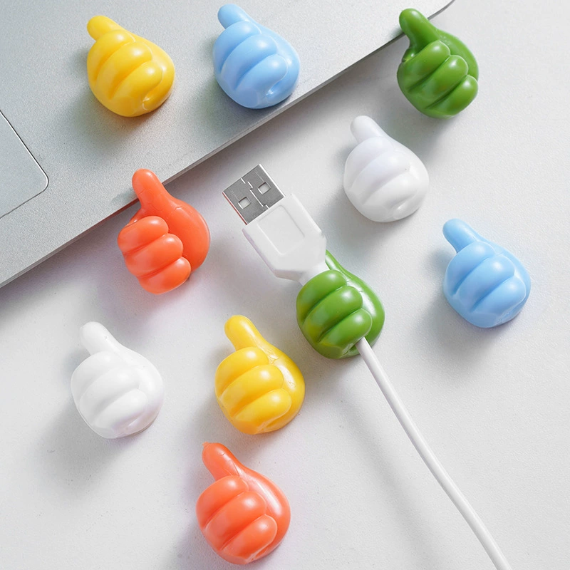Thumb -linked thread -mounted desktop data cable storage charger fixing device wall without trace avoiding punching sticky hook