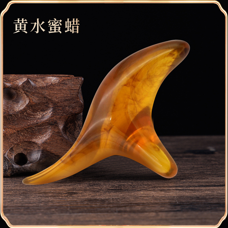 檀木の三角すずめのマッサージ器の蜜ろうの香木の筋の経絡の錐は足の底のツボの足を押してマッサージして穴の棒をつけます。