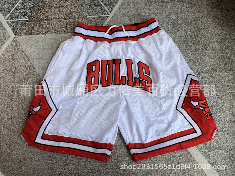 Comercio exterior pantalones de fútbol al por mayor Warriors Lakers 76 caliente Raptor mágico bolsillo bordado pantalones cortos pantalones de baloncesto NFL