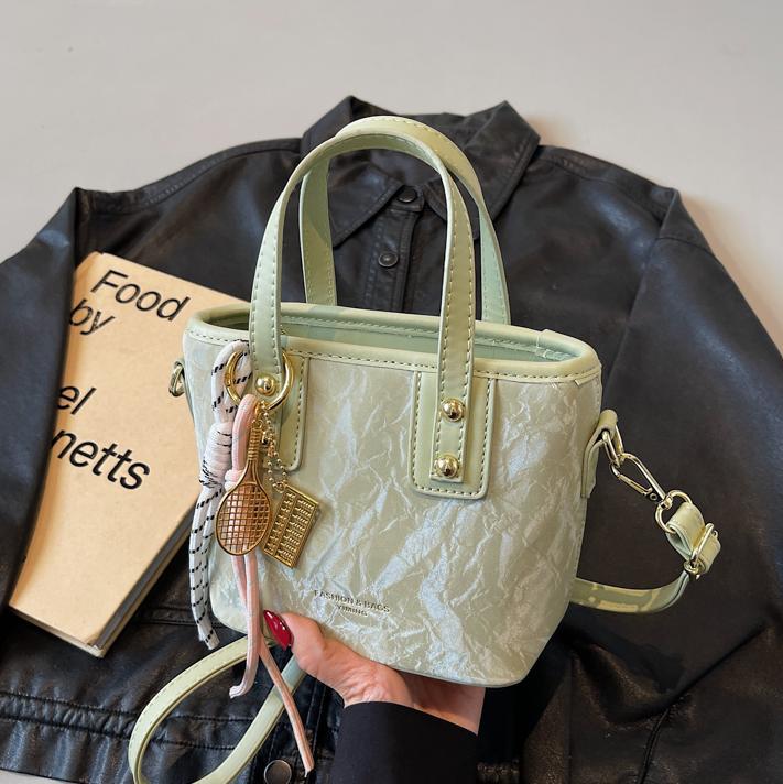 Comercio exterior explosión bolso de cubo de mano mujer 2025 nuevo simple bolso de hombro casual red explosión bolso de mochila coreano