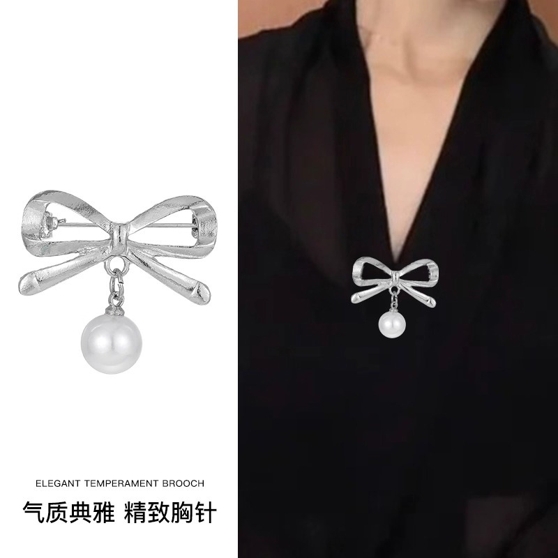 Temperamento bowknot perla alfileres mujer exquisita hebilla anti-luz sensación de alto nivel cintura artefacto cintura pantalones pequeña hebilla fija