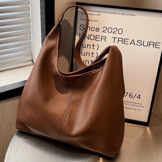 Bolsos de gran capacidad para mujeres primavera y verano 2025 nuevos bolsos de hombro de moda de alta calidad cubos de agua para niños y madres bolsa especial de cercanías