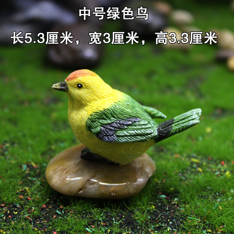 Oiseau vert moyen