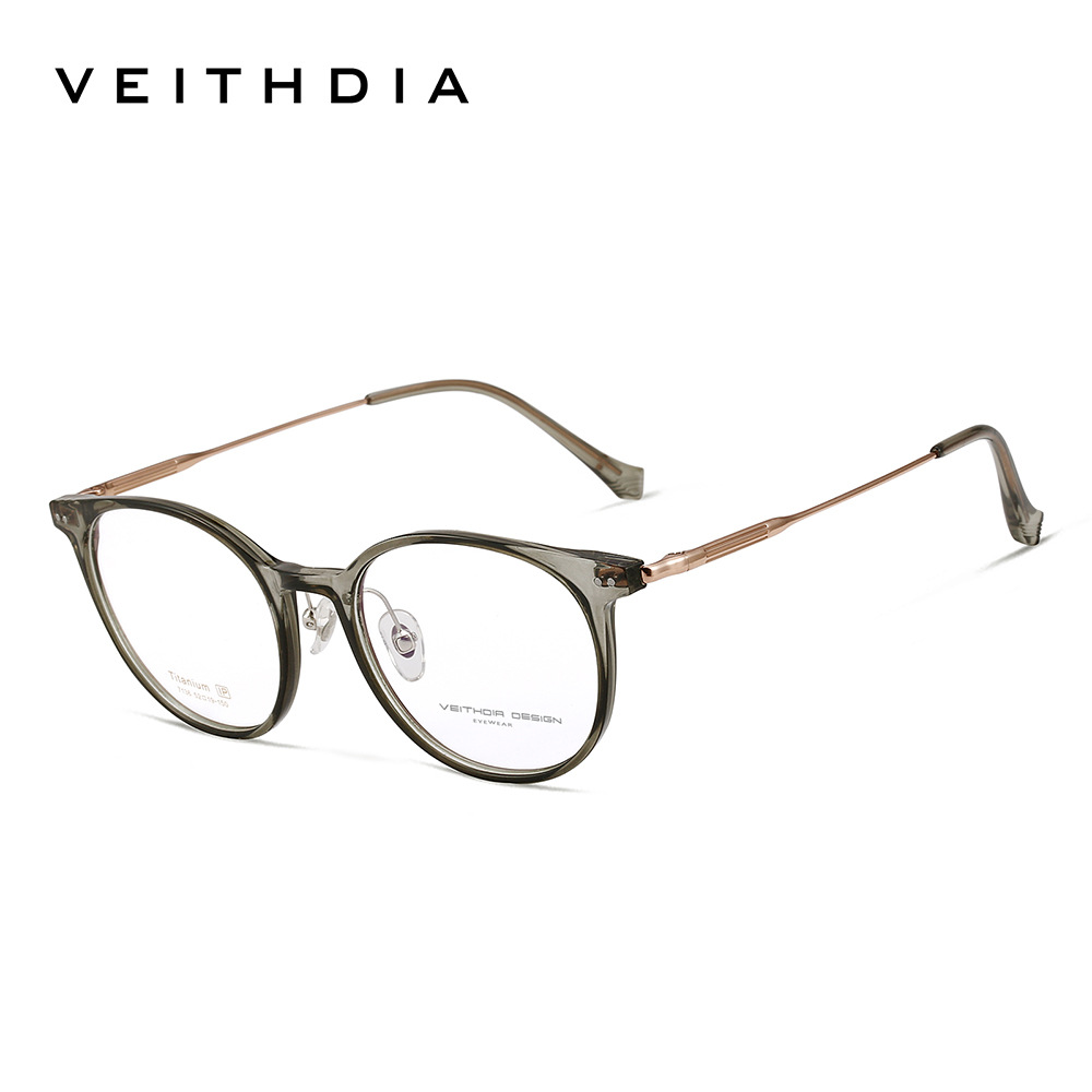 Marco de lente de miopía óptica de pie de titanio puro y ligero El marco de ojo masculino y femenino puede estar equipado con stock de transmisión en vivo 7136