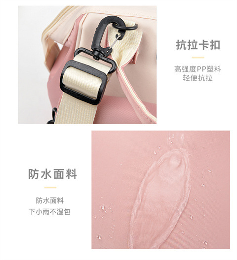 The Mommy bag is small and cute. It has a detachable front pocket and is a multi-functional baby bag. It is waterproof, lightweight, and has a crossbody design. It can be used to carry milk bags undefined