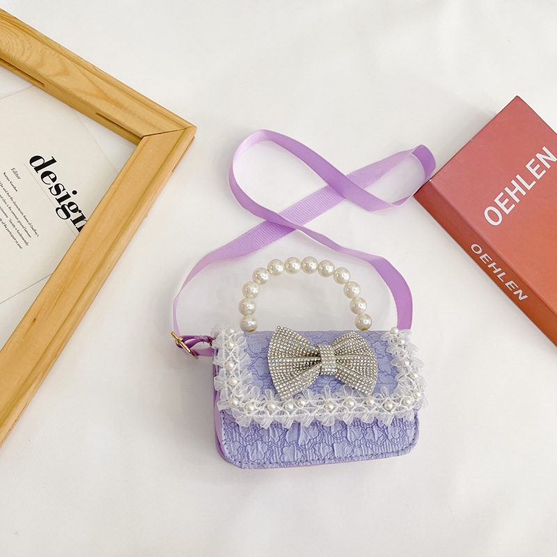 Bolsa de Niños de estilo coreano lindo arco perla Bolso pequeño princesa estilo occidental desgaste a juego joyería bolsa crossbody bolsa
