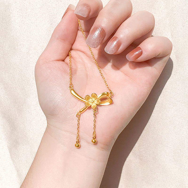 Oro flor arco collar cinta imitación oro borla joyería nicho Luz de lujo todo fósforo temperamento suministro al por mayor