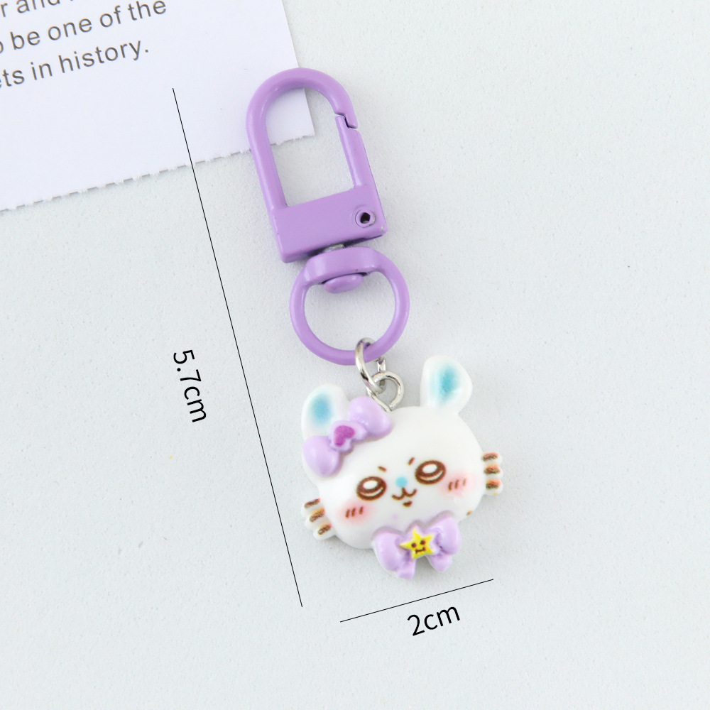 Caricatura linda corbata pequeña ocho llaveros colgantes pareja amigas bolsos colgantes de alto valor de belleza llaveros de corazón de niña