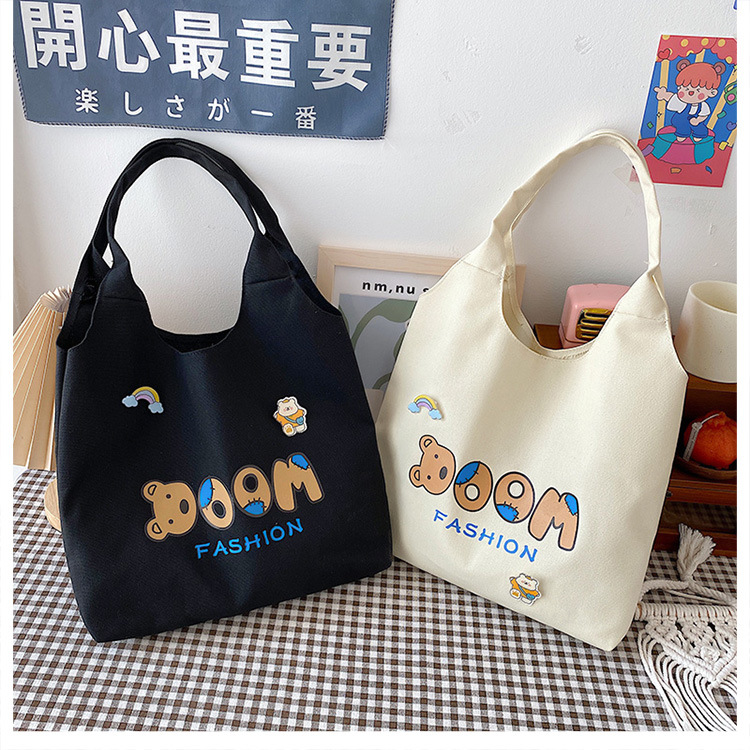 2021 Summer Japanese-style simple canvas bag, student backpack, single-shoulder handbag for going out, cartoon badge cotton bag undefined