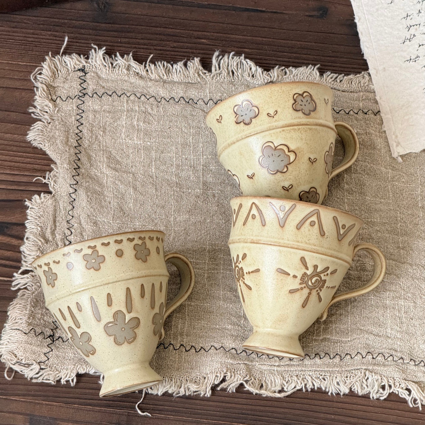Handmade underglaze retro totem ceramic goblets, wabi-sabi style, featuring small flowers in a forest setting, cute and aesthetically pleasing, perfect as a couple's set