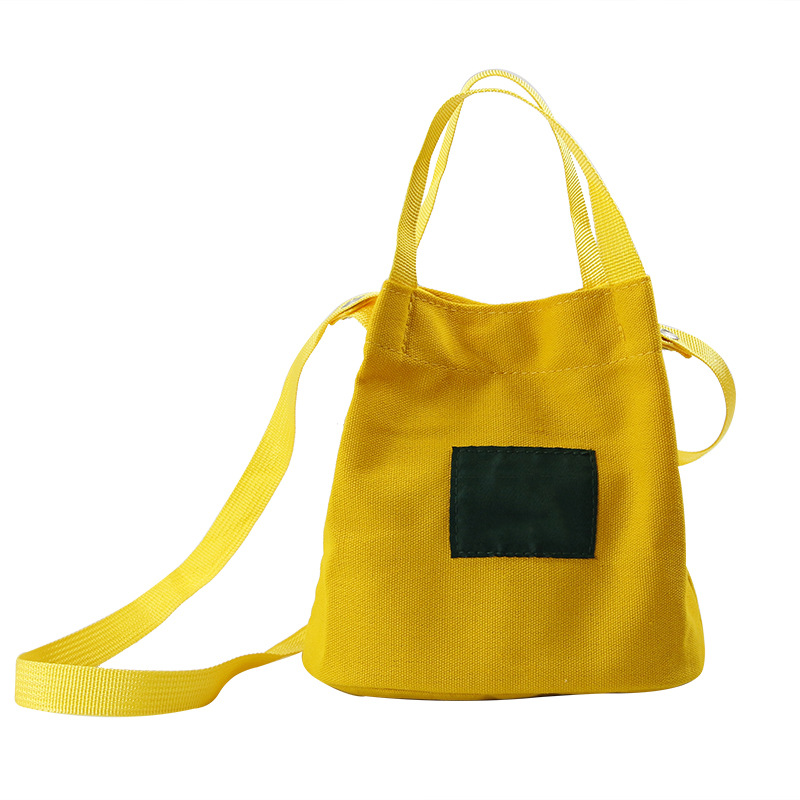 新款韩版简约文艺少女帆布包清新纯色时尚水桶包潮流休闲斜挎女包