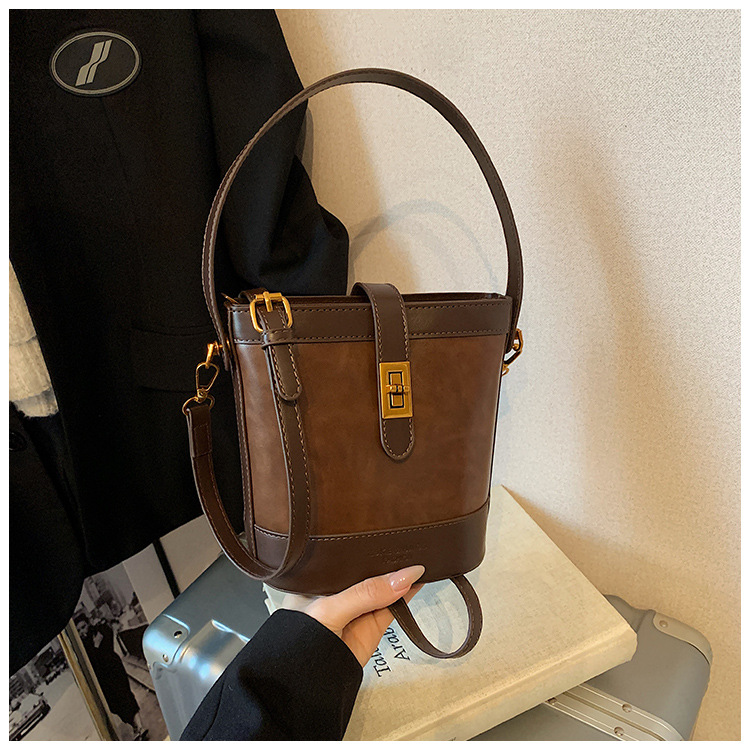 A retro color-blocking and textured hand-held bucket bag for women, a new 2024 trendy and fashionable small bag, a crossbody bag undefined