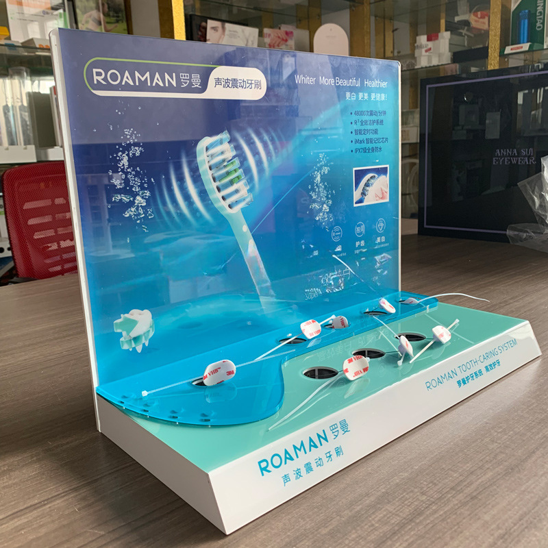 定制亚克力电动牙刷展示架 商场防盗锁报警器声波震动牙刷陈列架