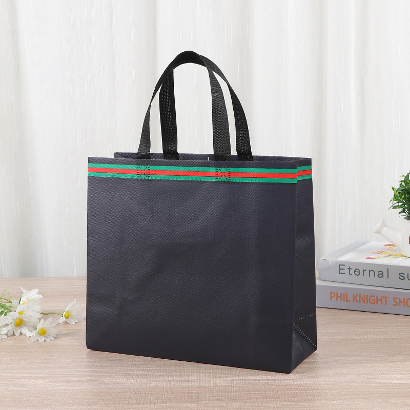 Bolsa de tela no tejida portátil gruesa bolsa de embalaje tridimensional resistente al desgaste de gran capacidad de equipaje de dormitorio de estudiantes bolsa de mano