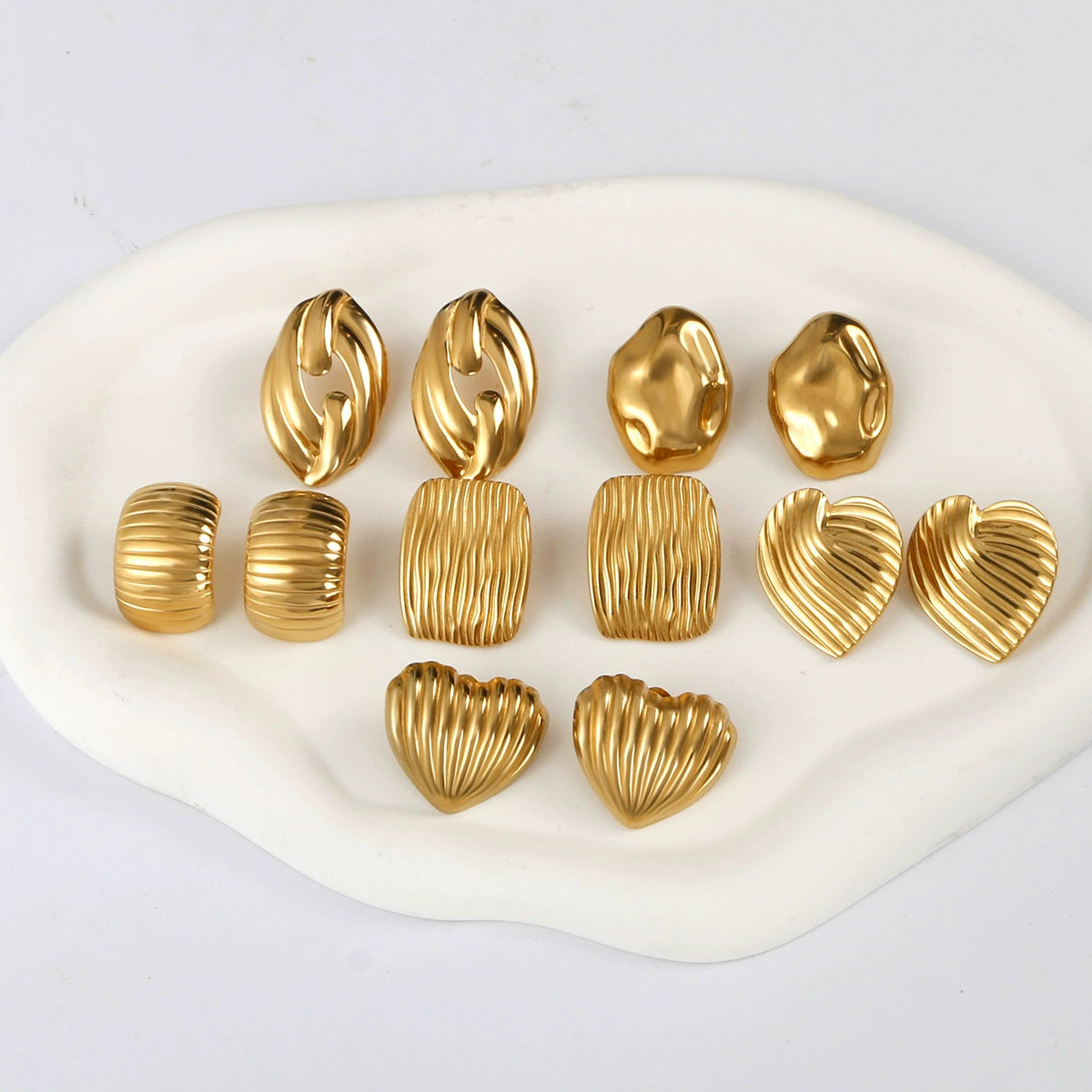 Европейские и американские геометрические серьги из нержавеющей стали, высококачественные нишевые серьги, серьги из титановой стали, модные и универсальные текстурированные серьги.