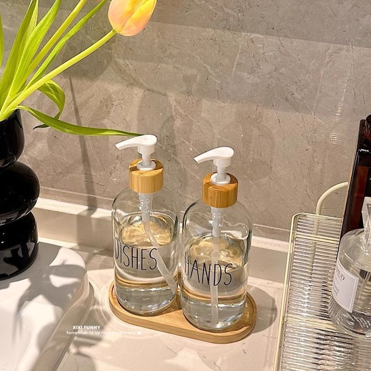 Gran volumen de vidrio nórdico envasado botellas vacías de baño desinfectante de manos gel de baño champú de presión en el lavabo de aire
