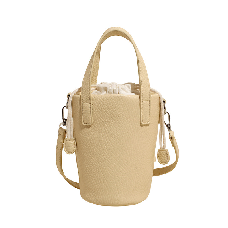 Bolso de cubo de cuero de cera de aceite retro con patrón de lichi transfronterizo para mujer 2025 nuevo bolso de mensajero de un solo hombro de diseño de nicho de alta gama