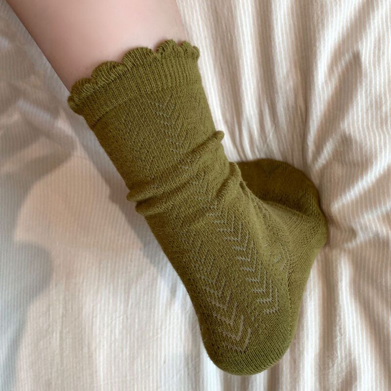Retro olive green socks for women, spring and autumn style, with ruffled edges, hollowed-out patterns, seamless design, and stacked style Retro olive green socks for women, spring and autumn style, with ruffled edges, hollowed-out patterns, seamless design, and stacked style