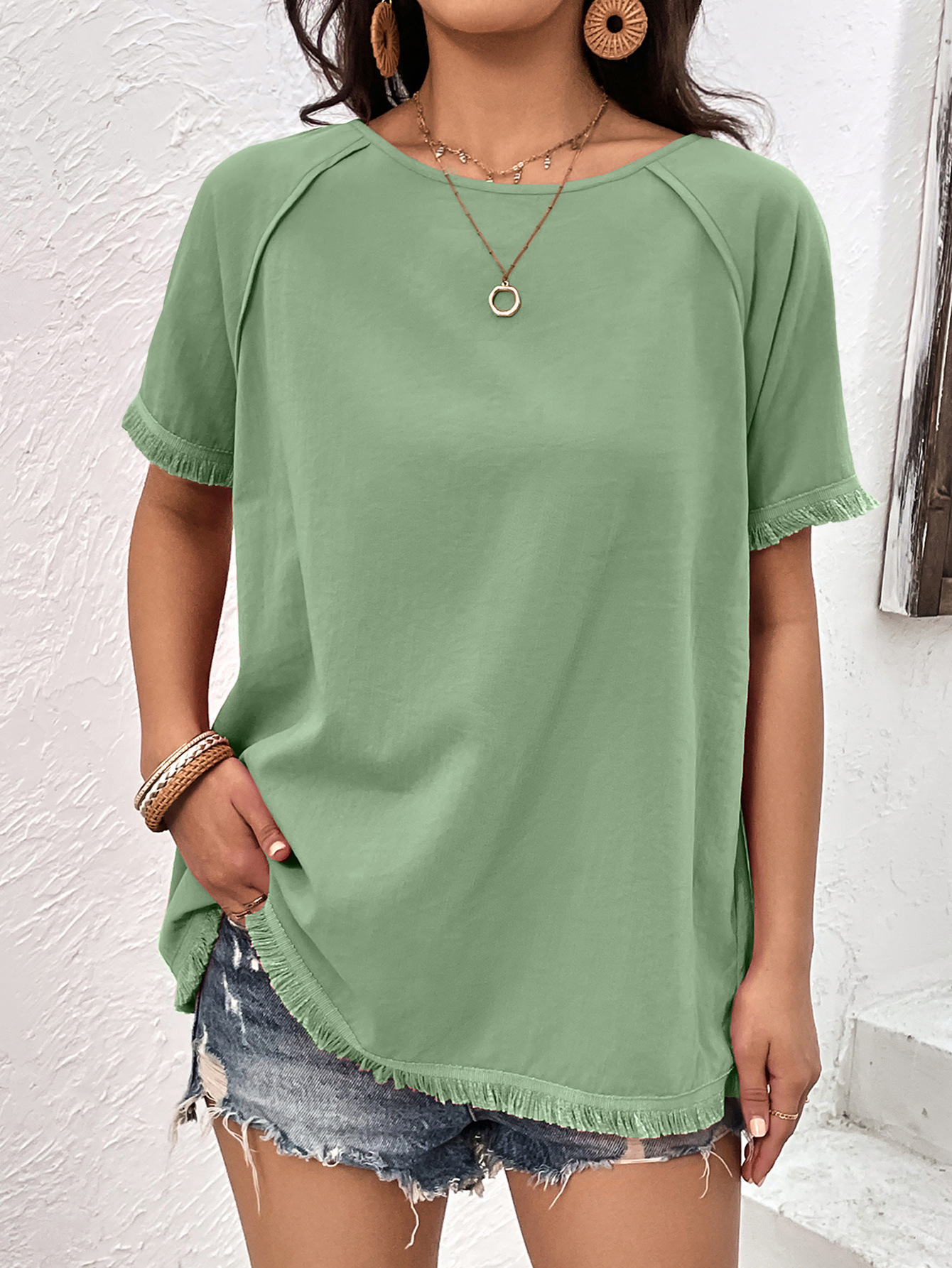 Top casual ampio con scollo tondo e frange da donna_voghion.com