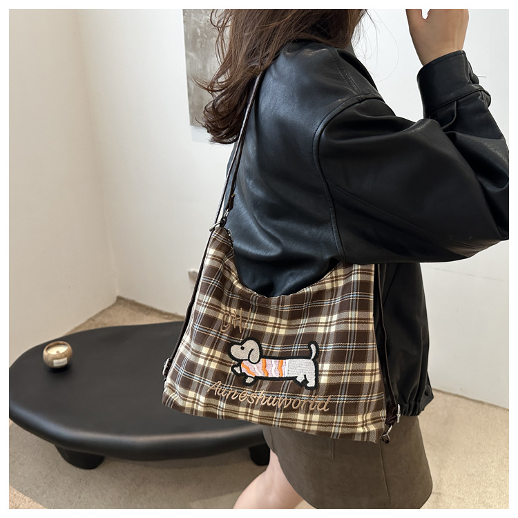 A new 2024 trendy and stylish backpack for women, featuring a cartoon checkered single-shoulder crossbody bag and a tote bag undefined