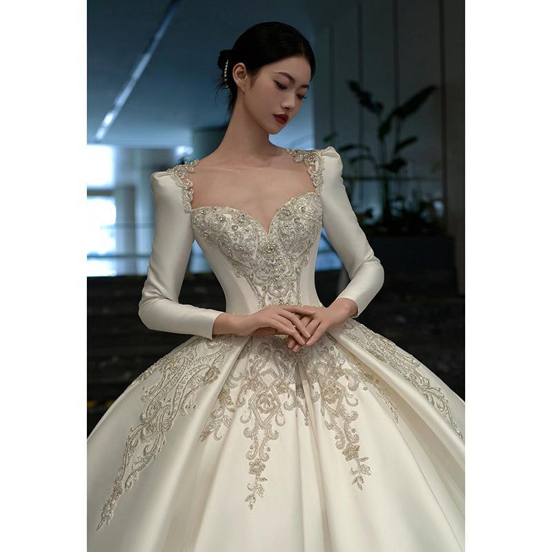 Vestido de novia de satén texturizado de alta gama, estilo invierno 2026, de manga larga, estilo princesa, con cola, de lujo, estilo francés.
