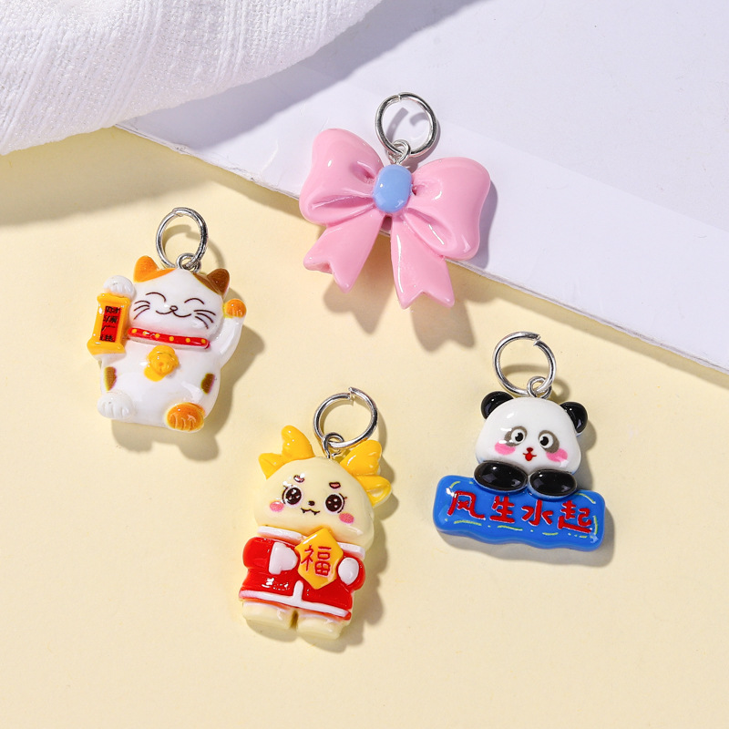 Llavero de material de resina de dibujos animados al por mayor, accesorios lindos, colocación creativa, colgante de bolsa portátil