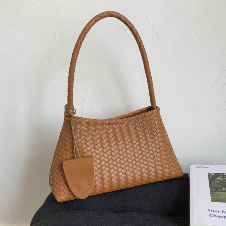 Bolsas de tejido casuales transfronterizas texturas bolsas de brazo mujeres otoño y invierno 2025 nuevo bolso de estilo extranjero bolso de hombro de moda