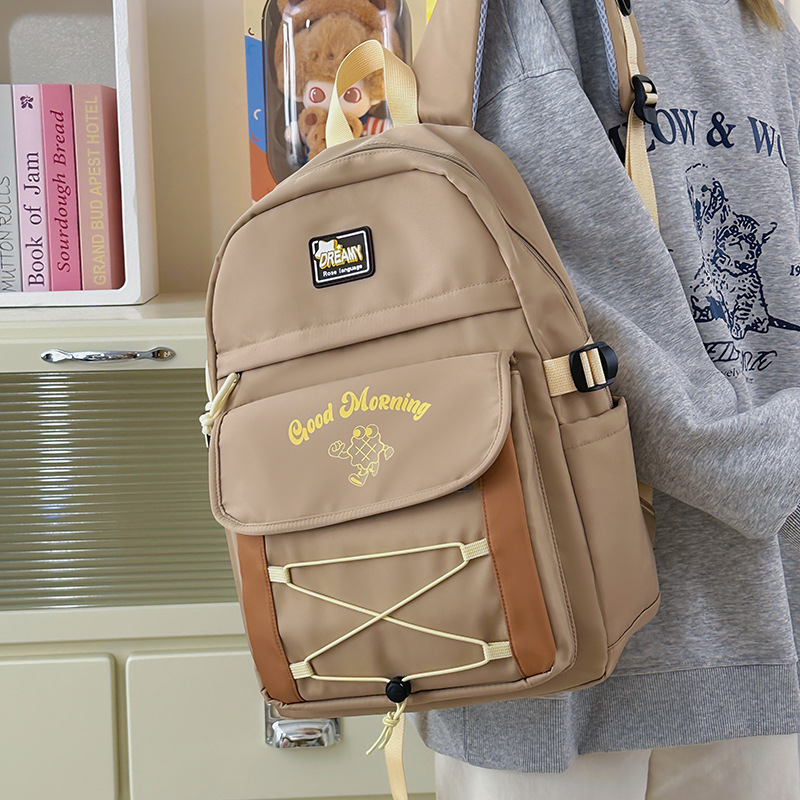 Mochila de estilo universitario de color de contraste lindo mujer 2025 nueva mochila de estilo crema casual campus escuela secundaria escuela secundaria