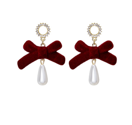 Aguja de plata Otoño e Invierno rojo vintage flocado arco borla pendientes ins Año Nuevo vino rojo Bola de piel pendientes de perlas