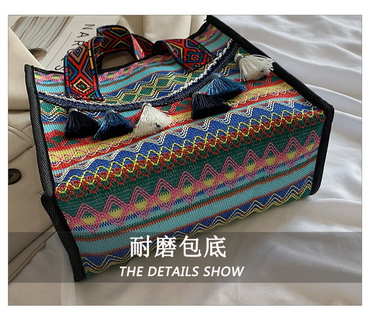 New hand-held fringed shopping bag 2022, fashionable ethnic style, Hong Kong style bucket bag, versatile woven bag for women undefined