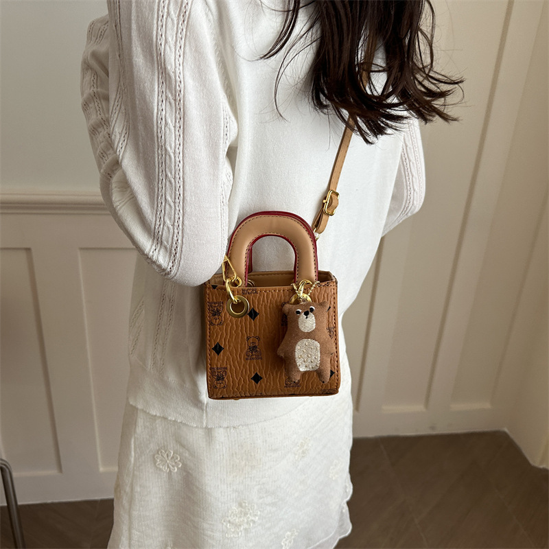 2026 nuevo bolso infantil caricatura lindo oso impresión bolso de hombro de moda mini bolso de bebé