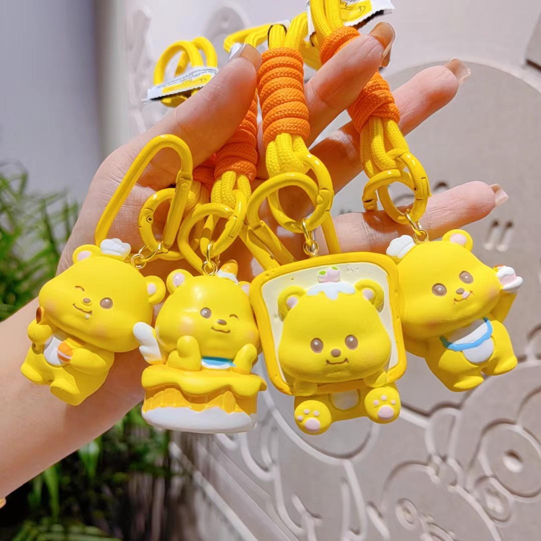 Creativo caricatura crema osos llaveros pareja llaveros llaves de automóvil colgantes bolsos de chicas colgantes regalos