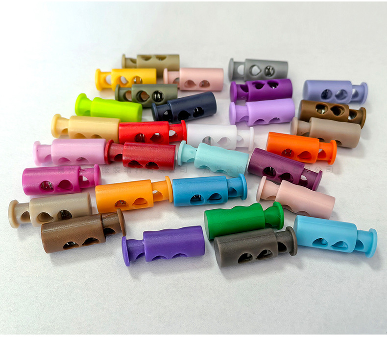 Kunststoff-Farbfedern-Schnallenverschluss, zweilöchrige zylindrische Seilschnalle, Daunenjacken-Verstellschnalle, Elastic-Stopper, Rutschfester Verschluss, Glockenform-Schnalle