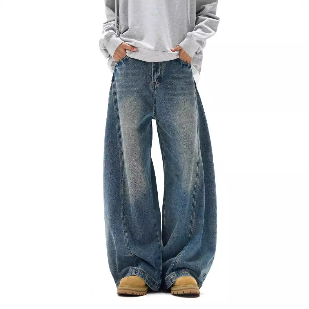 アメリカのレトロなつなぎ合わせの曲がった刀のジーパンの男性のゆったりした広脚のごろつきの帥のoversizeは広脚の垂れ下がった感じのズボンを構造します。
