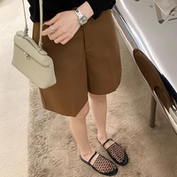 Summer new hollow out niche design for women to wear flat bottomed sandals with a toe wrap on the outside