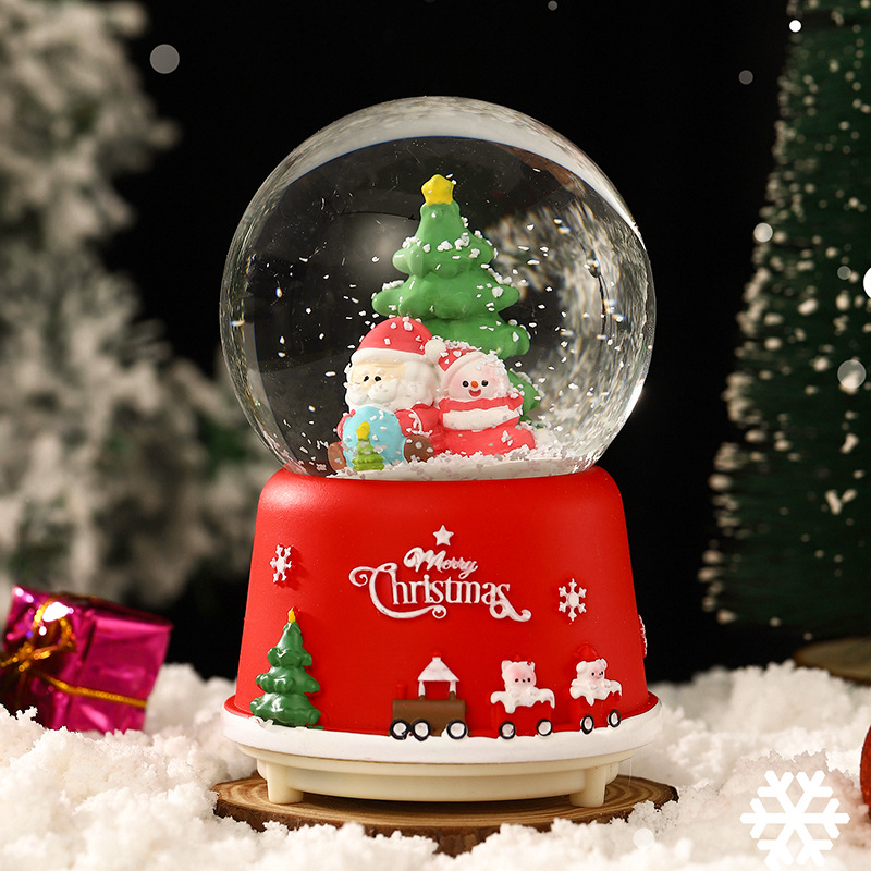 Una variedad de regalos de decoración de Navidad Navidad iluminante bola de cristal caja de música ventana diseño de velas lámparas de viento árbol de Navidad