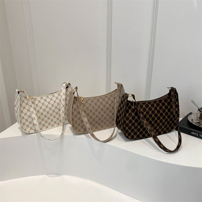 Bolsa de hombro coreana de estilo extranjero con textura de 2024, nueva bolsa de moda de mujer, bolsa de luna media luna, impresión retro, bolsa de tramo pequeño.