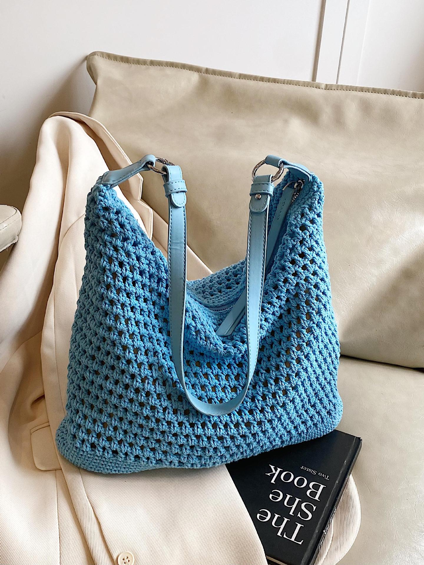 Venta caliente de verano nuevo producto bolsa tejida hueca para mujer 2025 bolsa de playa estilo vacaciones bolsa de paja de gran capacidad bolsa de cubo