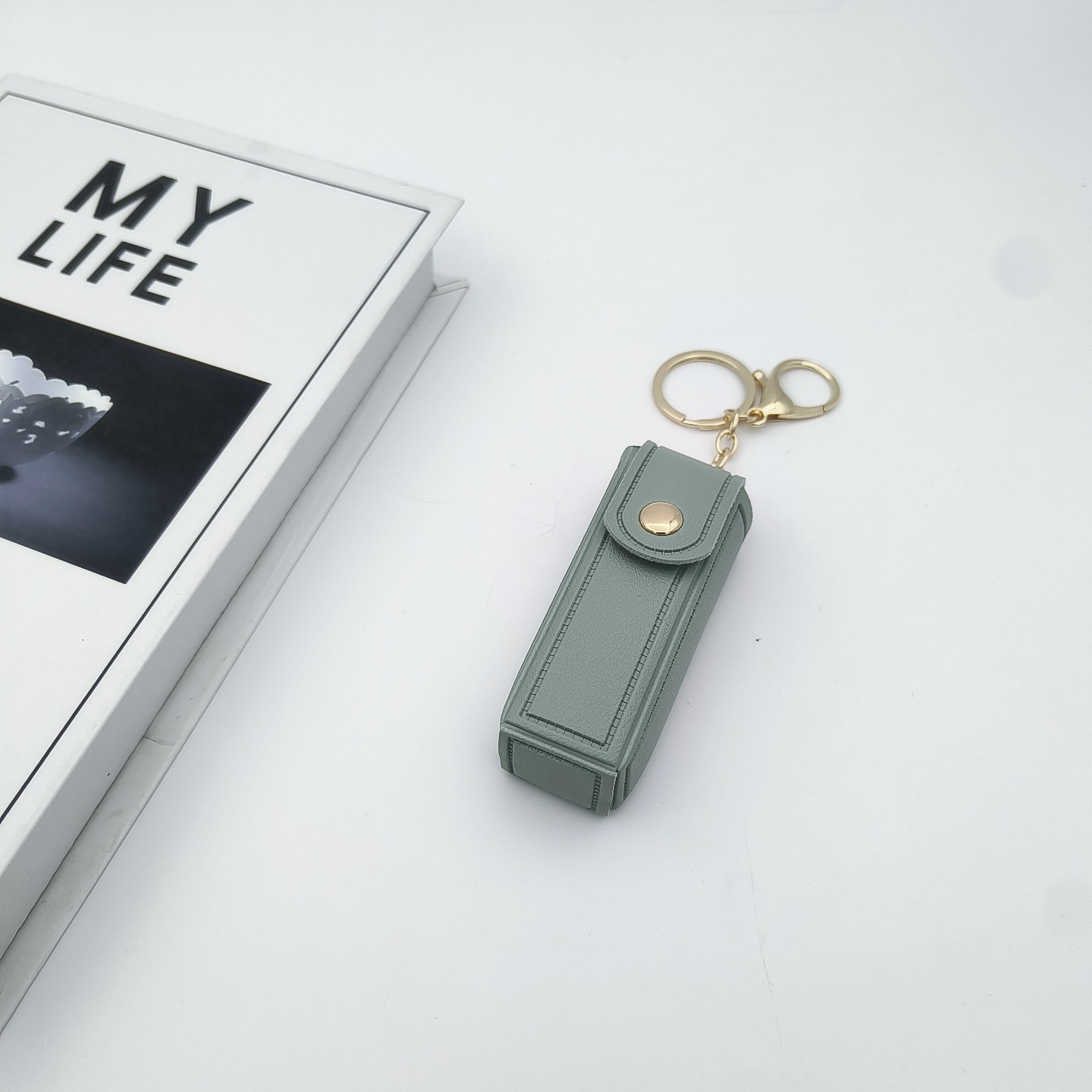 Bolso de cambio transfronterizo sobre rojo espejo creativo llavero colgante pequeño PU cuero bolso de coche accesorios accesorios en stock