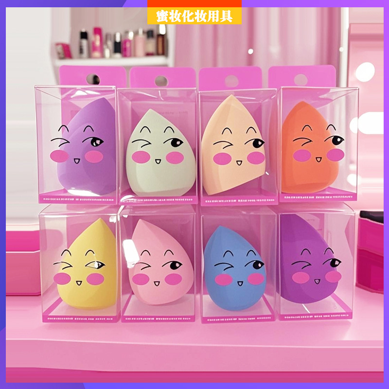 PVC caja transparente lindo huevo de maquillaje lindo expresión huevo de maquillaje colorido no látex agua se vuelve más grande esponja polvo de maquillaje