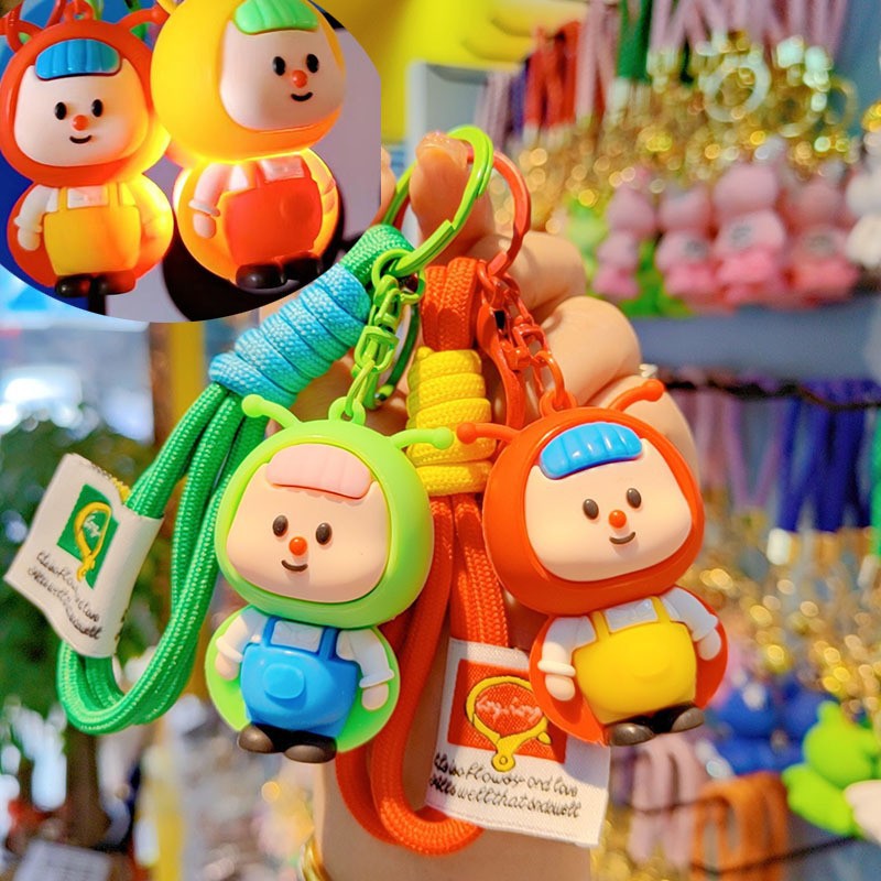 lindos dibujos animados luciérnagos llavero rojo estereoscópico muñeca de goma suave colgante de alto valor de la cara brillante pareja colgante