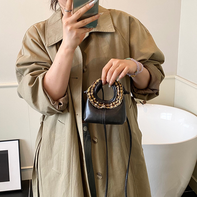 2025 otoño / invierno nuevo bolso infantil lindos bolsos de bebé de encaje redondo bolsos de mano mini niños de color sólido