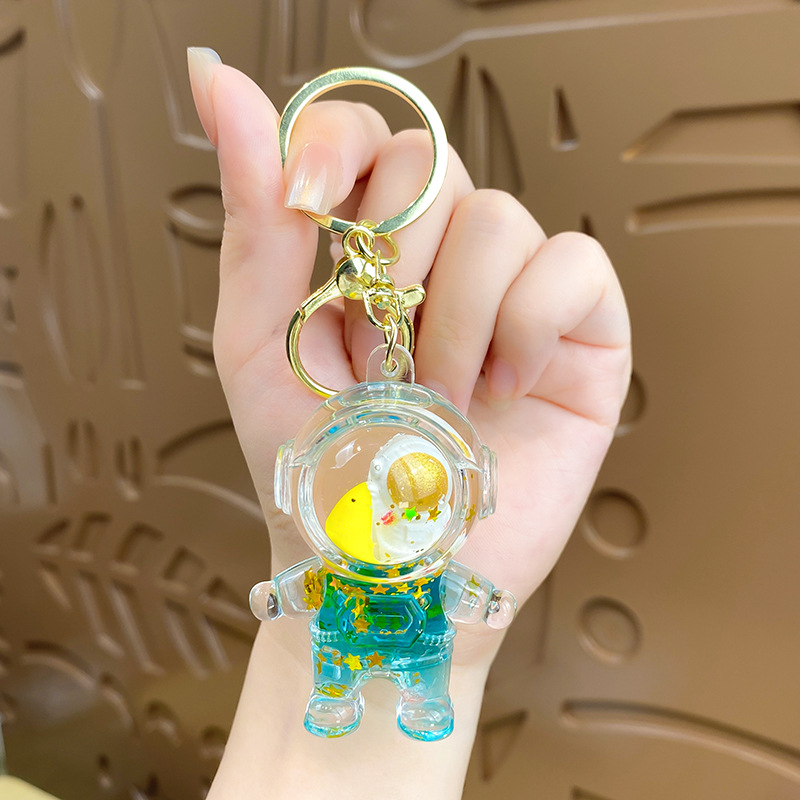 Dibujos animados cosmonauta astronauta astronauta muñeca llavero accesorios de automóvil creativos lindo bolso de pareja colgante regalo