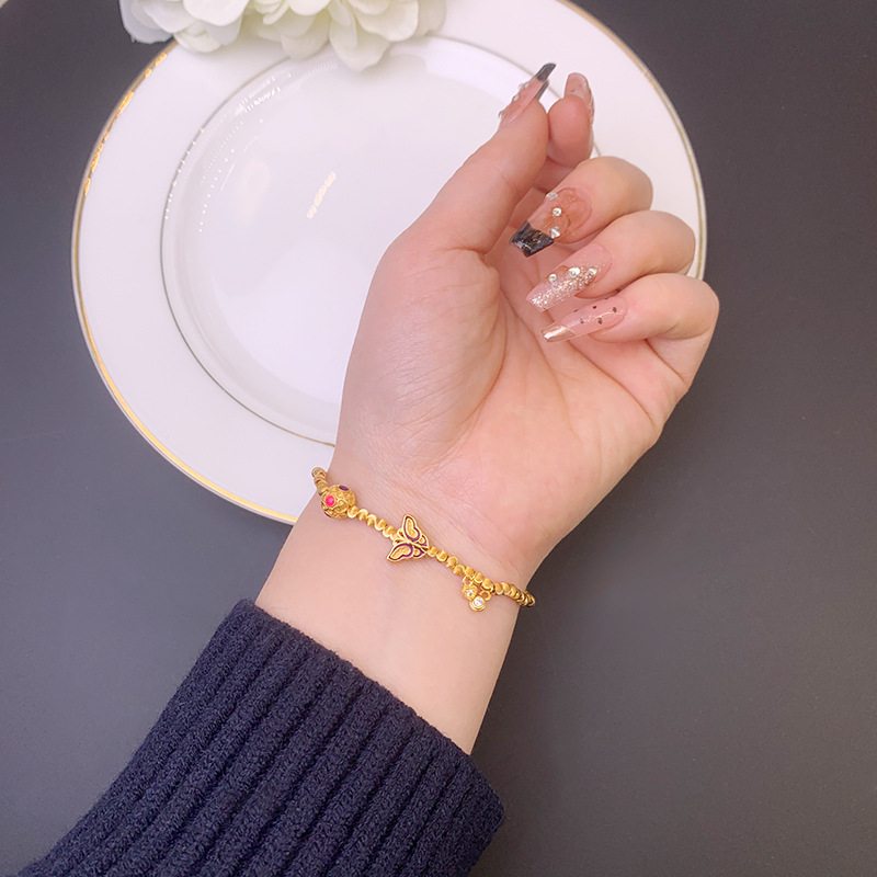 Nuevo estilo chino de oro de arena vietnamita de moda nacional mariposa silla pulsera de bola de seda nicho de diseño de joyería al por mayor