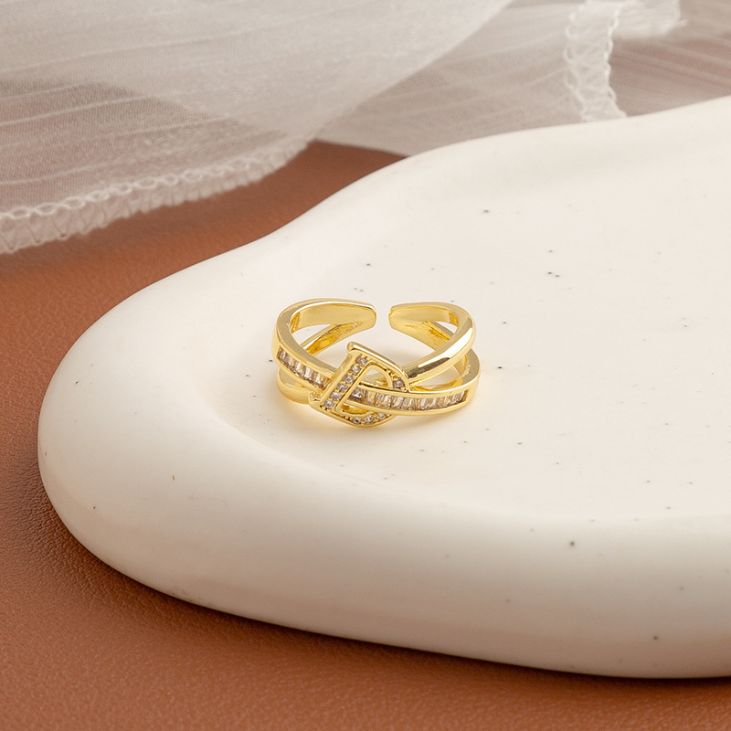 Golden ring with letters