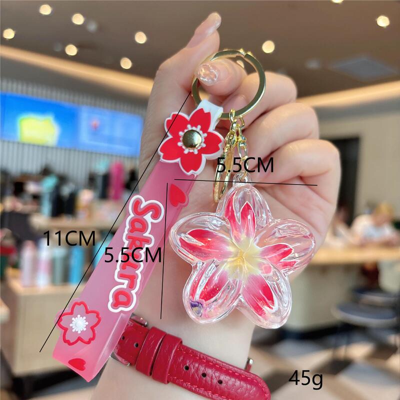 クリエイティブオイル入りプルメリアキーホルダー花液体流砂小さなペンダントバッグアクセサリーカップル小さなギフト|undefined